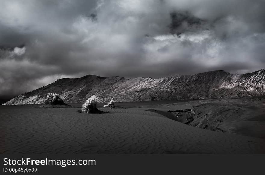 Bromo Mountain has always been fascinating object because of the mixture sand dune and mountainous area and mysterious cloud. The picture is taken using infra-red sensitive camera which adds more details to the clouds and its shadows. Bromo Mountain has always been fascinating object because of the mixture sand dune and mountainous area and mysterious cloud. The picture is taken using infra-red sensitive camera which adds more details to the clouds and its shadows.