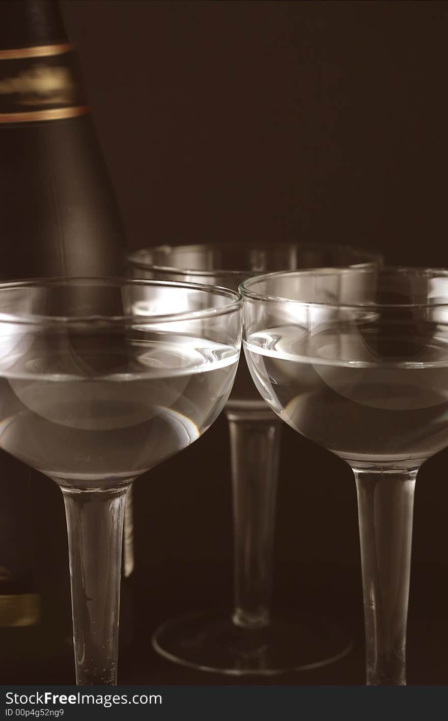 Image from christmas series: bottle and goblets on champagne