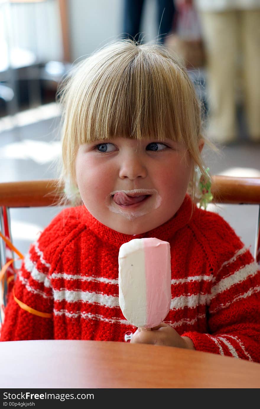 The girl eats ice-cream. With appetite.