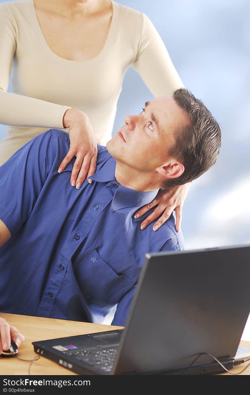 A woman massages her boyfriend. A woman massages her boyfriend