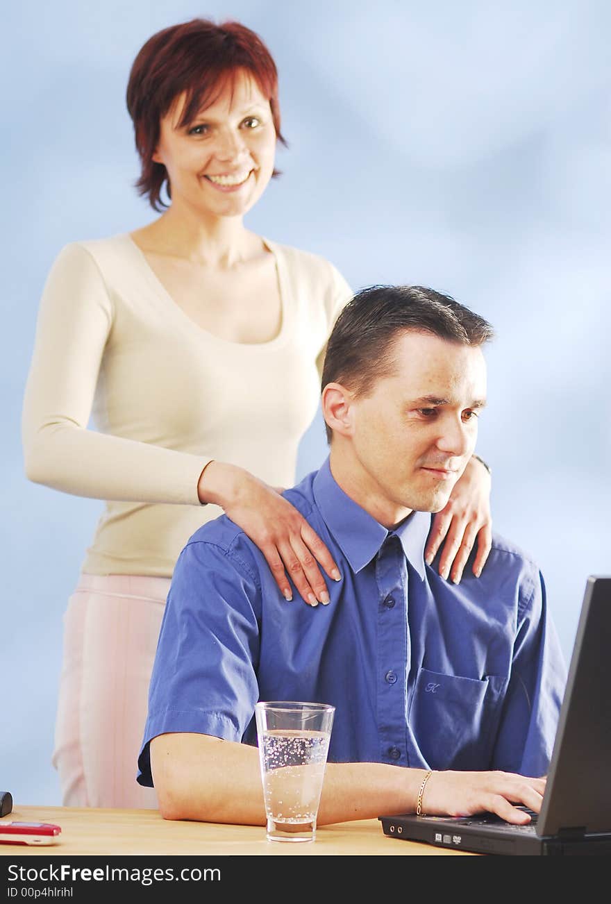 A woman massages her husband. A woman massages her husband