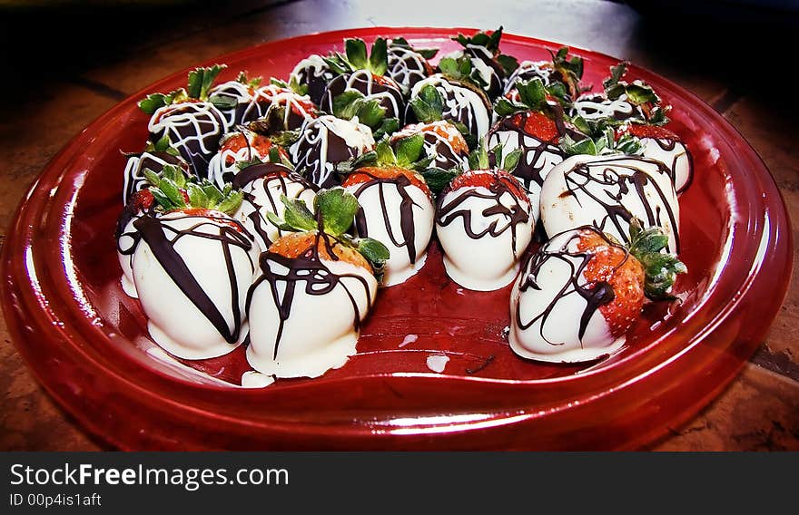 A dish of delicious chocolate covered strawberries. A dish of delicious chocolate covered strawberries