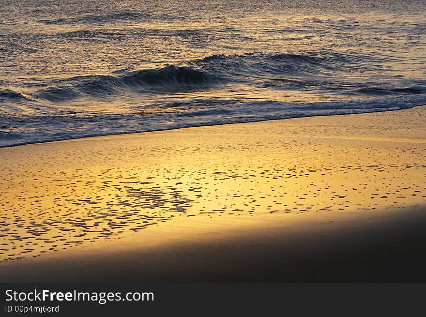 A picture of ocean water and sand. A picture of ocean water and sand