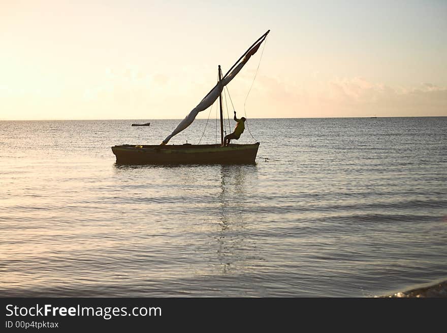 Setting dhow sail or traditional wooden boat on the islands. See the rest in this series. Setting dhow sail or traditional wooden boat on the islands. See the rest in this series.