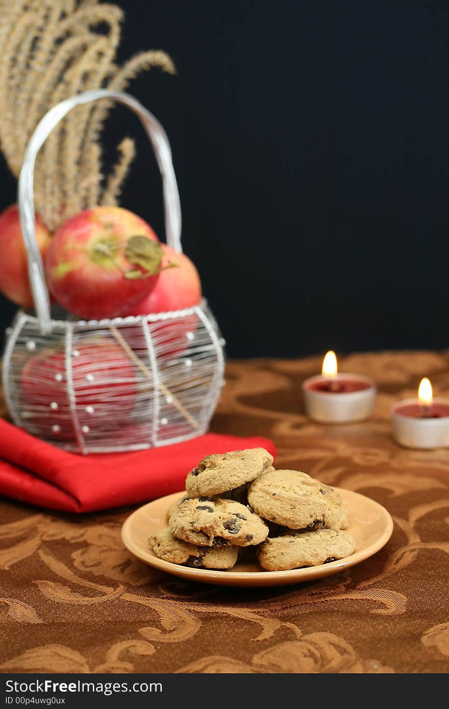 A plate of chocolate chip cookies on a dessert table. A plate of chocolate chip cookies on a dessert table