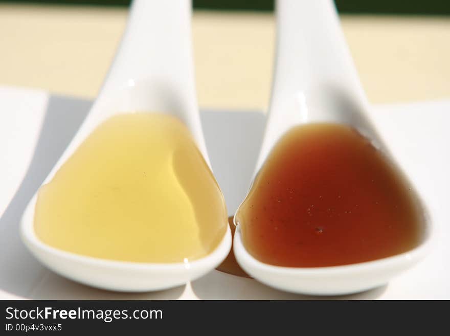 Two sorts of honey in a spoon