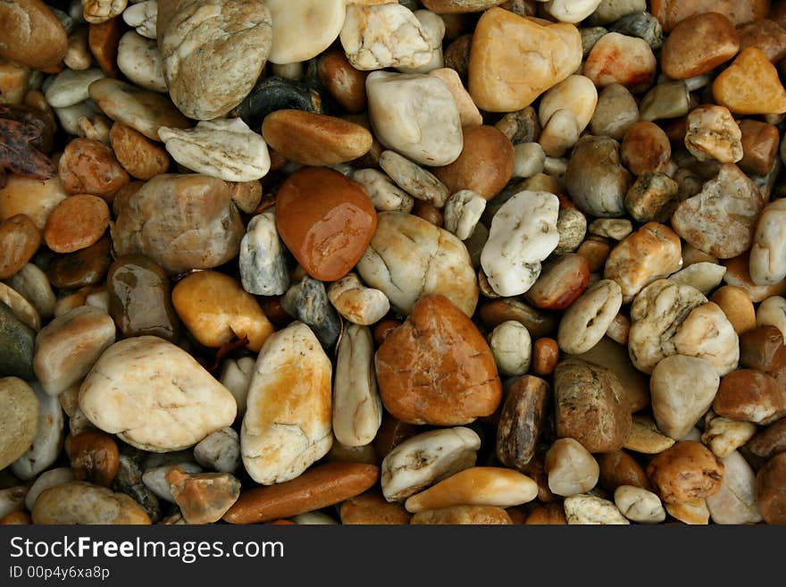 Wet colorful pebbles (gravel, pebble stones)