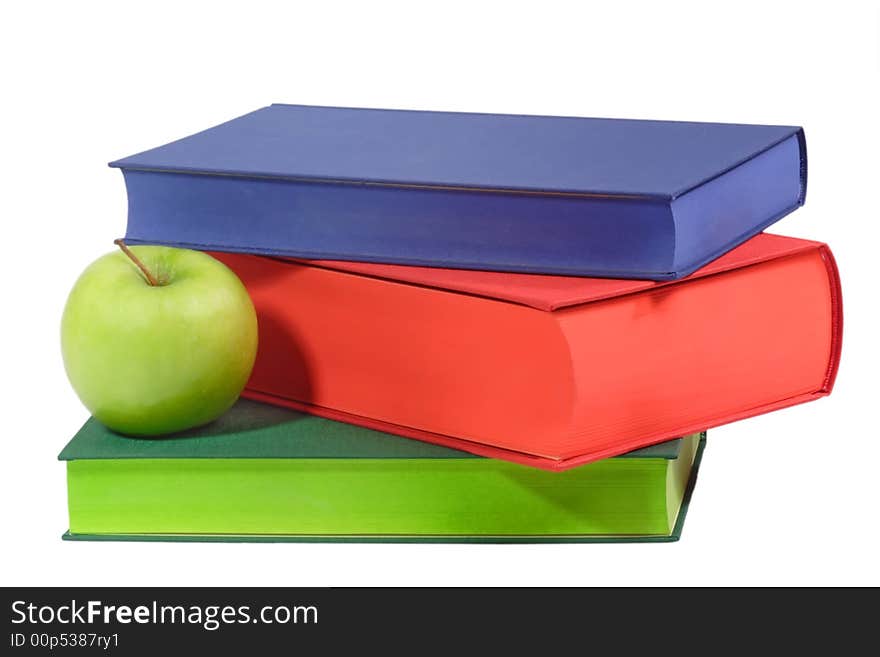 Three books with apple - isolated on white background. Three books with apple - isolated on white background