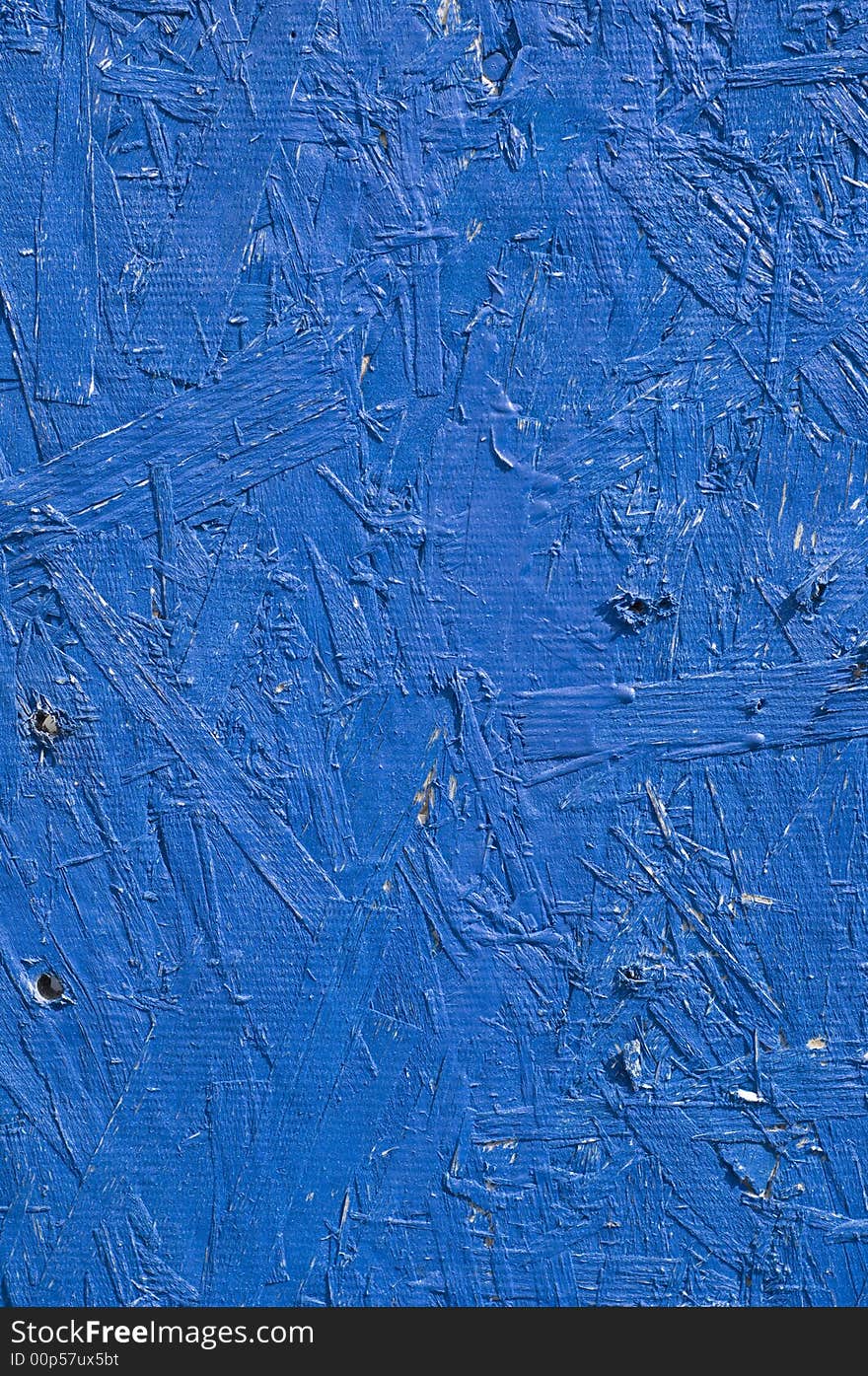 Particleboard that is painted blue. Particleboard that is painted blue