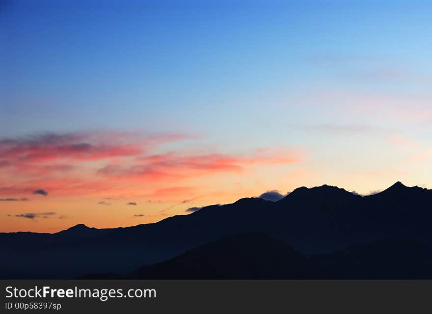 Mountain and trees at sunrise