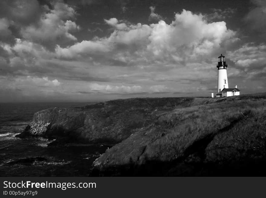 Yaquina head lighthouse on the oregon coast helps to safely guide north and south bound shipping on the pacific ocean. Yaquina head lighthouse on the oregon coast helps to safely guide north and south bound shipping on the pacific ocean