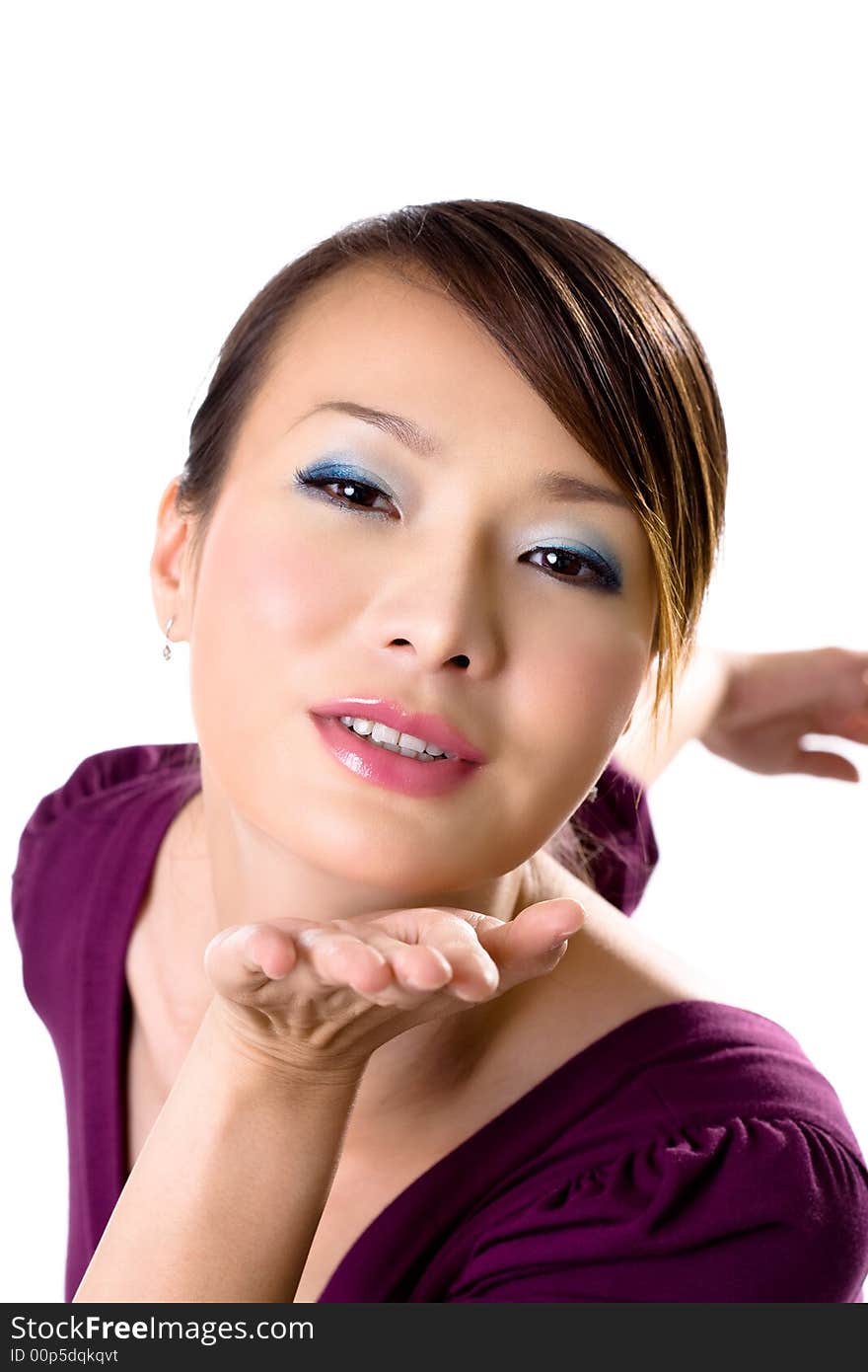 Beautiful Asian woman in purple dress giving blowing kisses happily. Beautiful Asian woman in purple dress giving blowing kisses happily