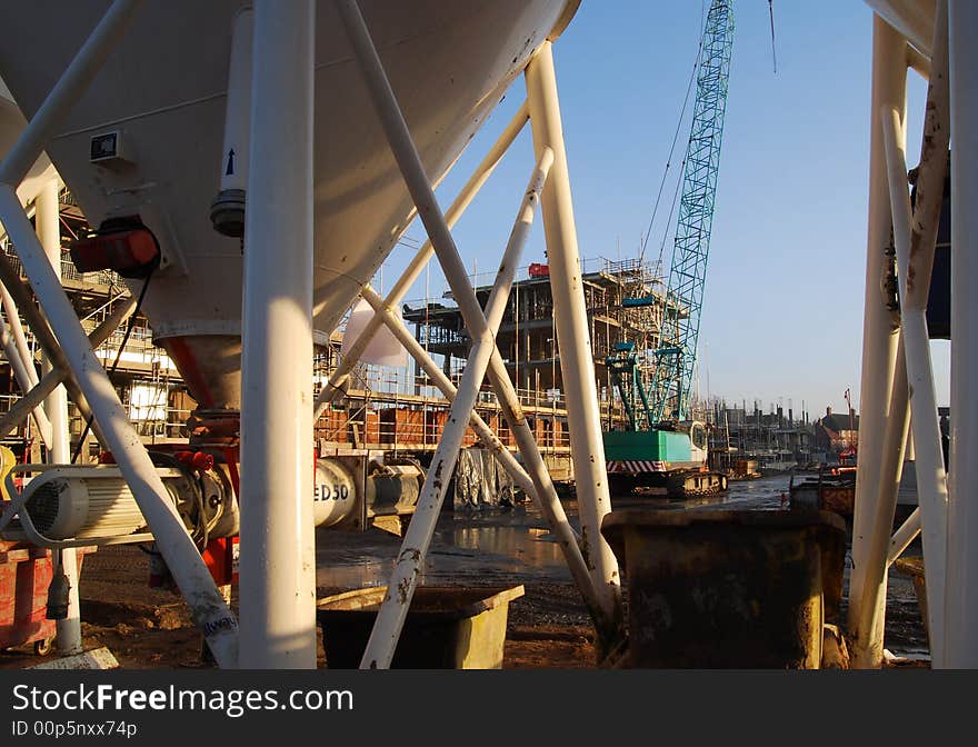 View of building site showing crane and building. View of building site showing crane and building