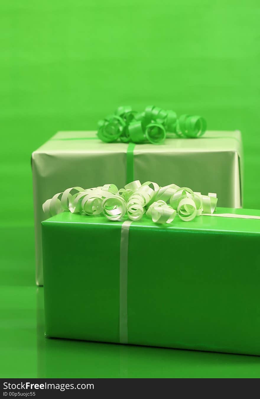 Presents wrapped in light and dark green paper. Presents wrapped in light and dark green paper