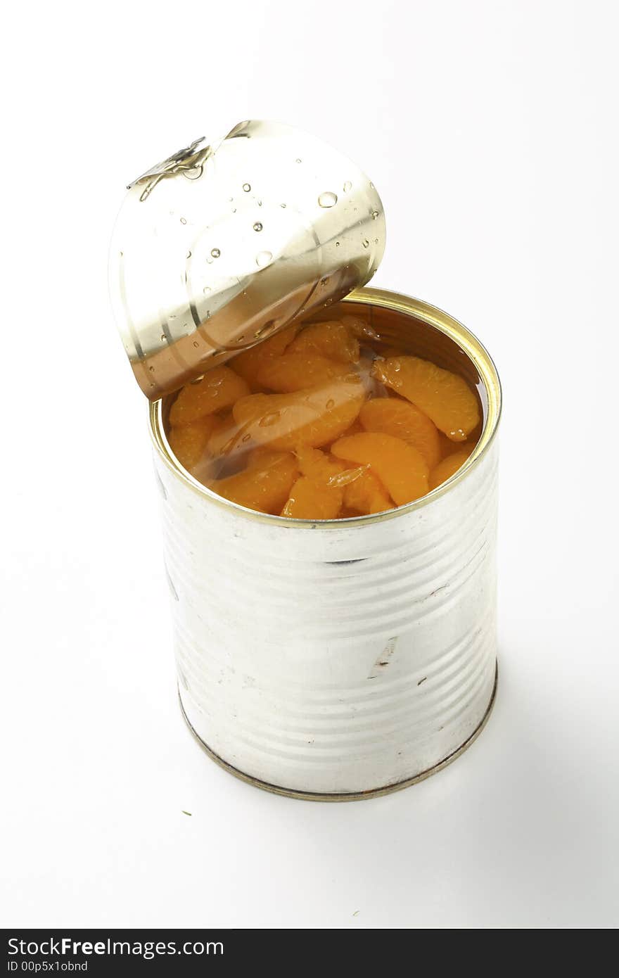 Tin with tangerines on white background