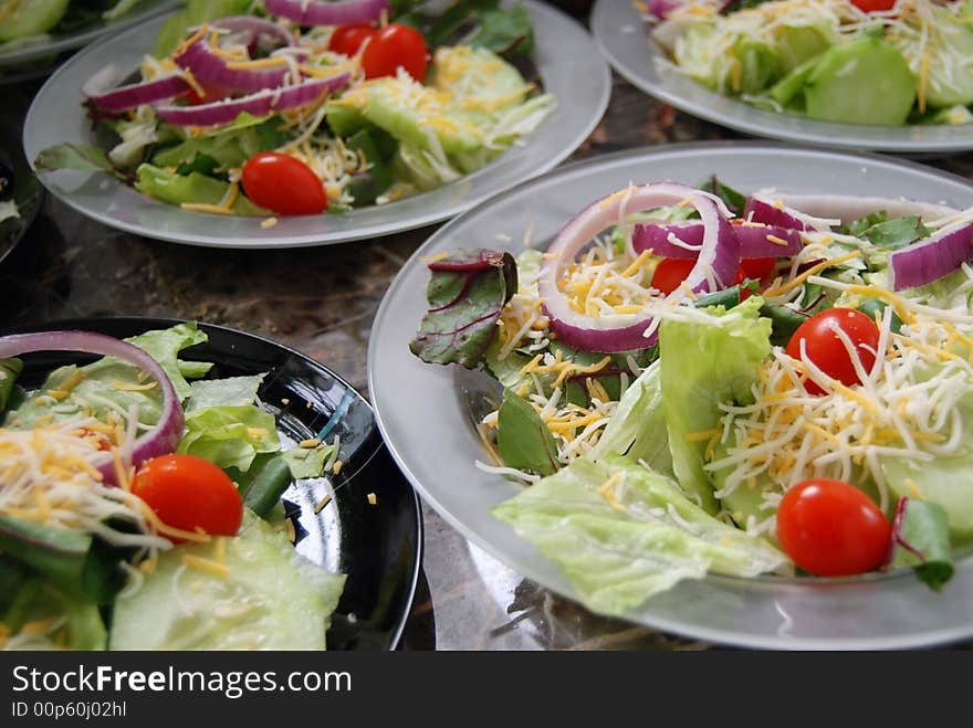 Toss salads on crystal plates. Toss salads on crystal plates.