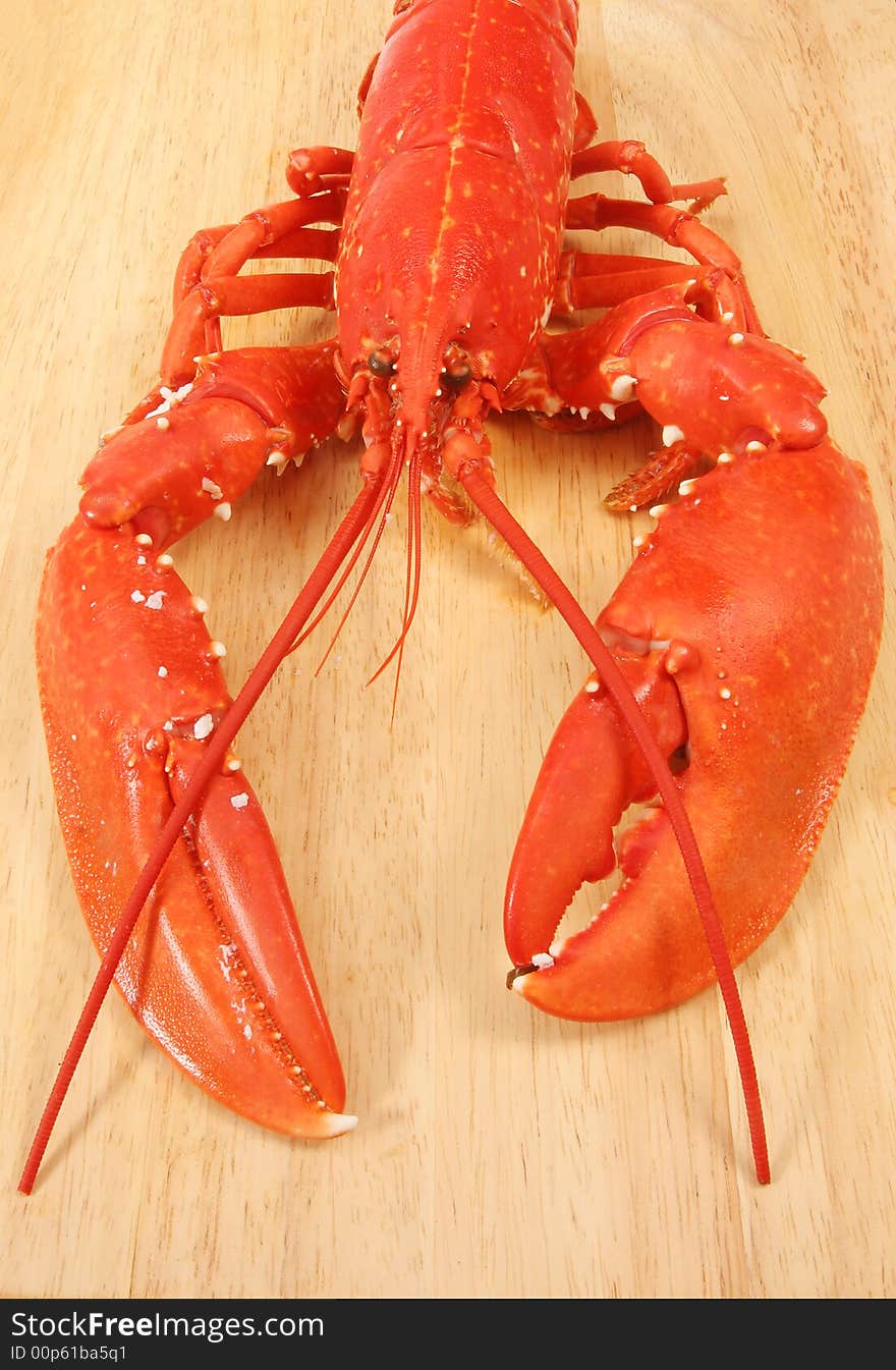 Cooked lobster on a wooden board