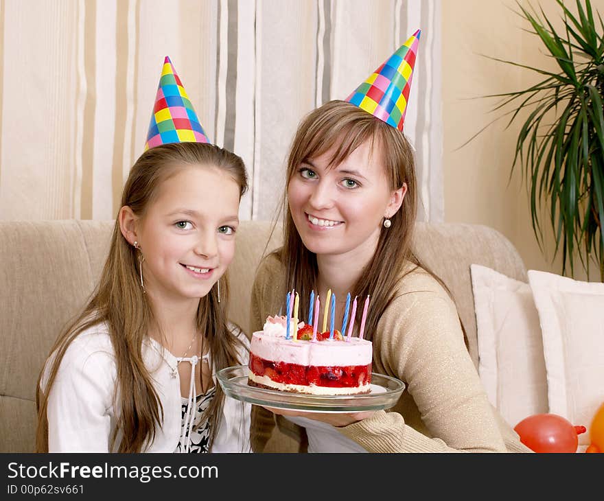 Mother with daughter and birthday cake. Mother with daughter and birthday cake