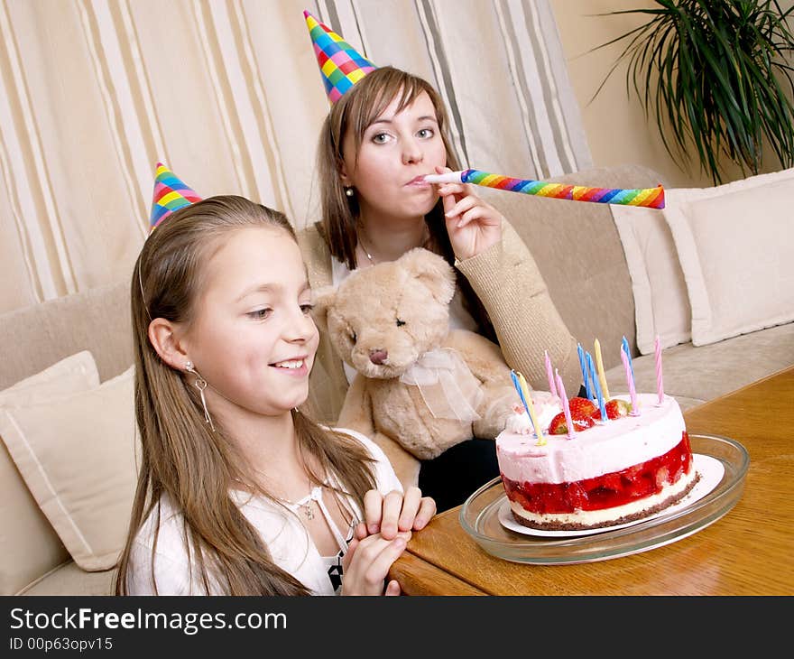 Mother with daughter and birthday cake. Mother with daughter and birthday cake