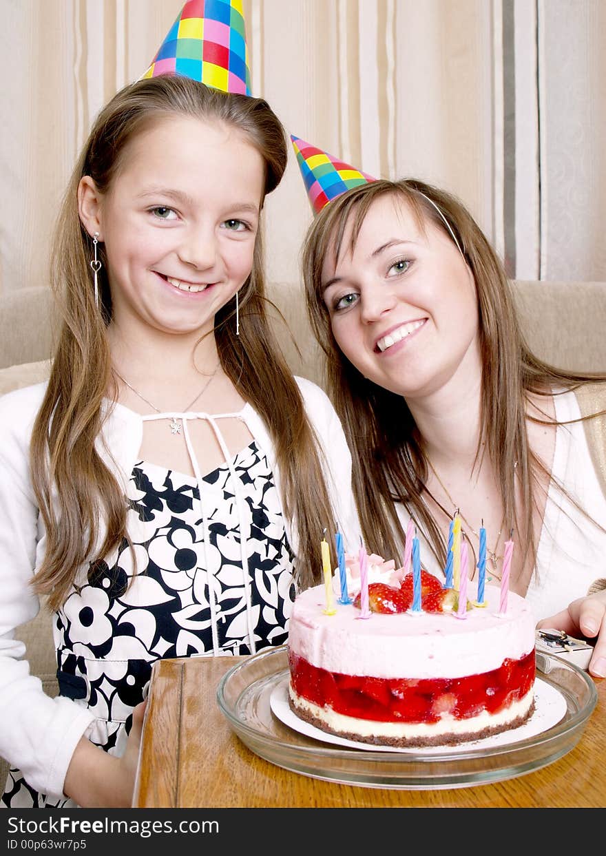 Mother with daughter and birthday cake. Mother with daughter and birthday cake