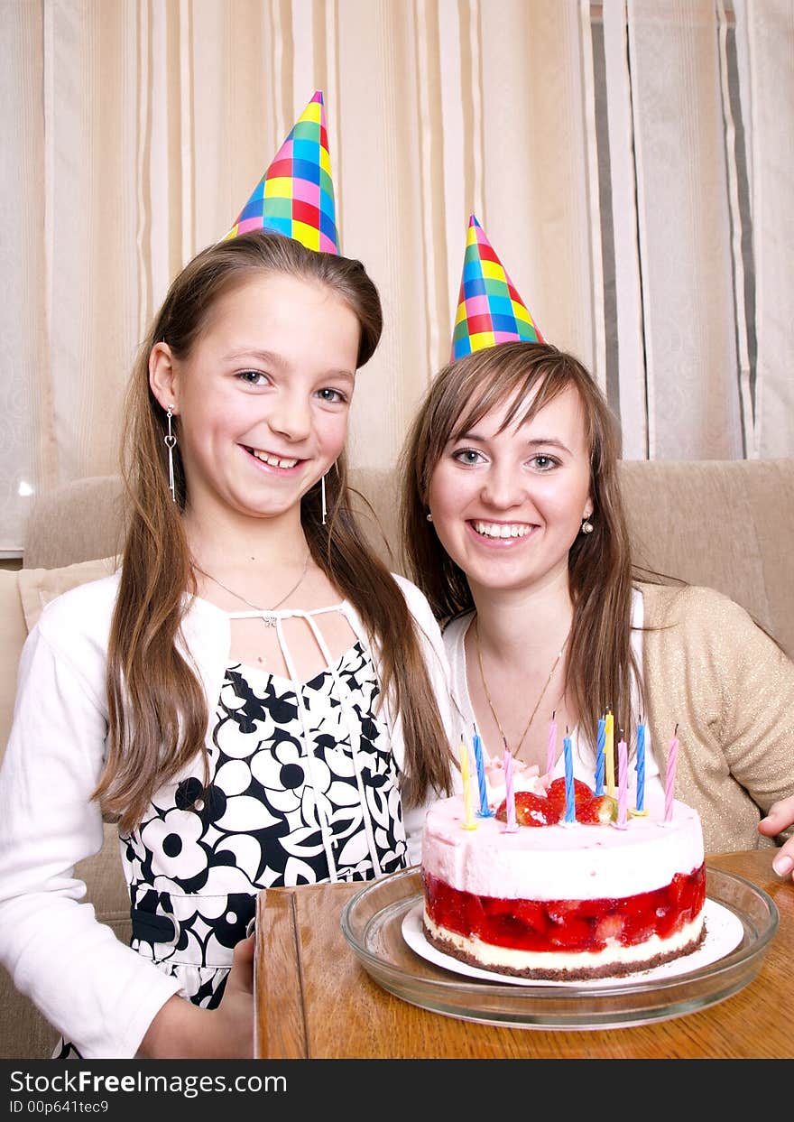 Mother with daughter and birthday cake. Mother with daughter and birthday cake