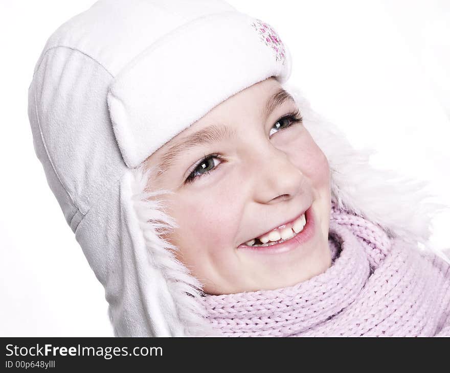 Closeup of girl, wearing wool winter hat and scarf