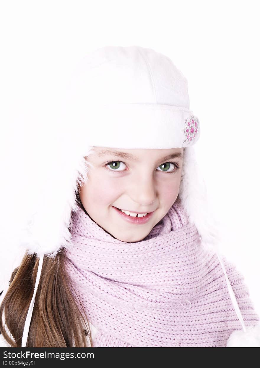 Closeup of girl, wearing wool winter hat and scarf