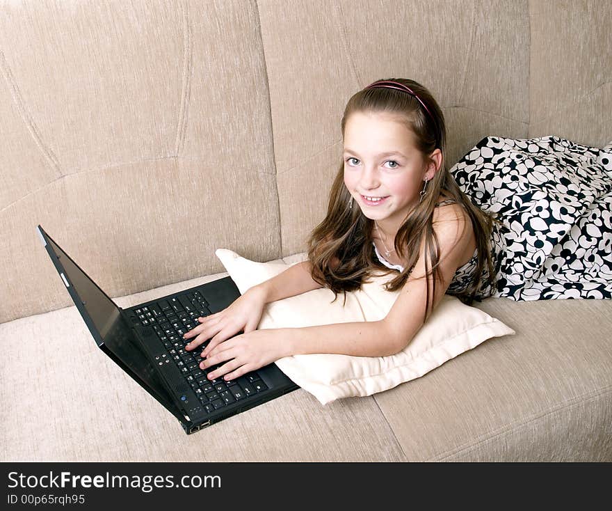 Young girl using a laptop.