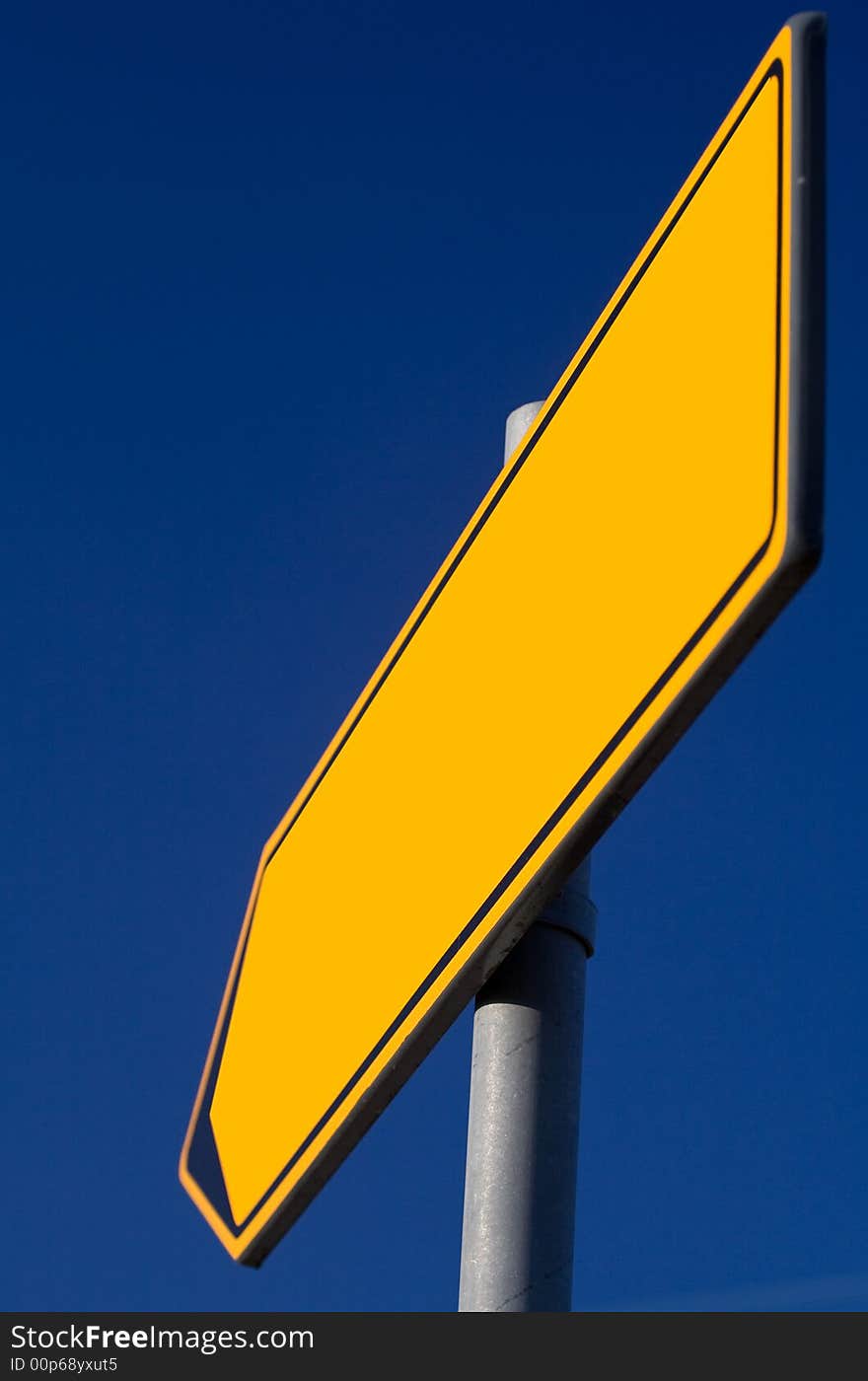 Traffic sign of direction over blue sky