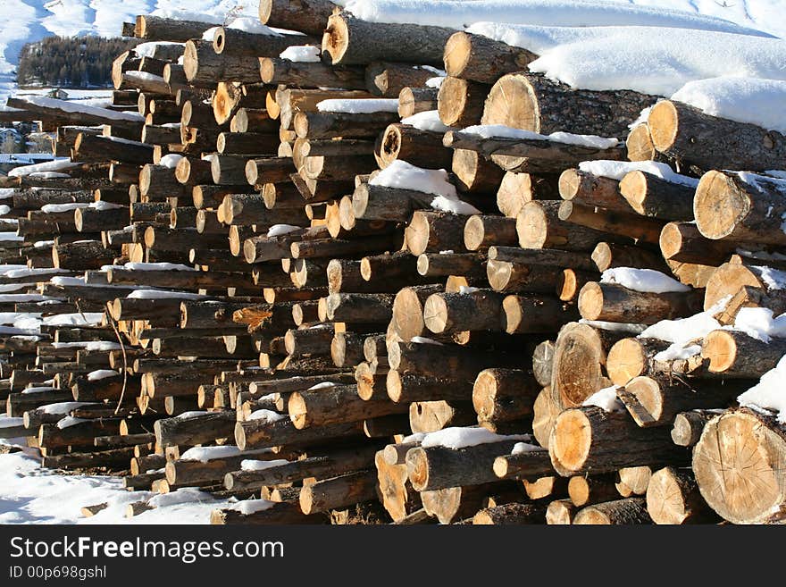 A stack of wood covered by snow. A stack of wood covered by snow