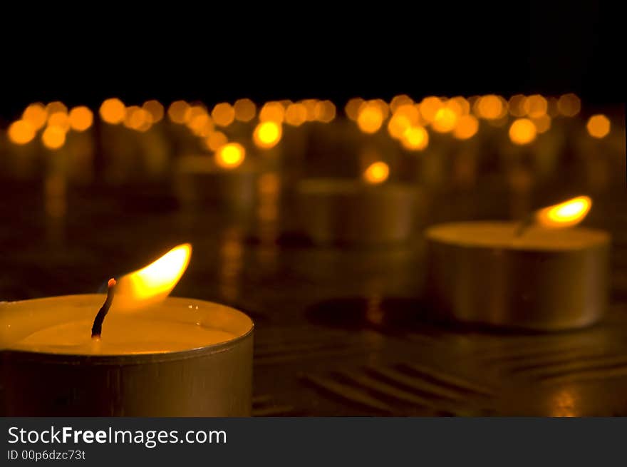 Close up view of the candles in the darkness