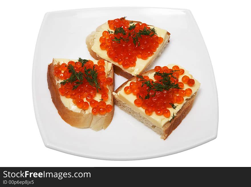 Sandwiches with red caviar on a white plate