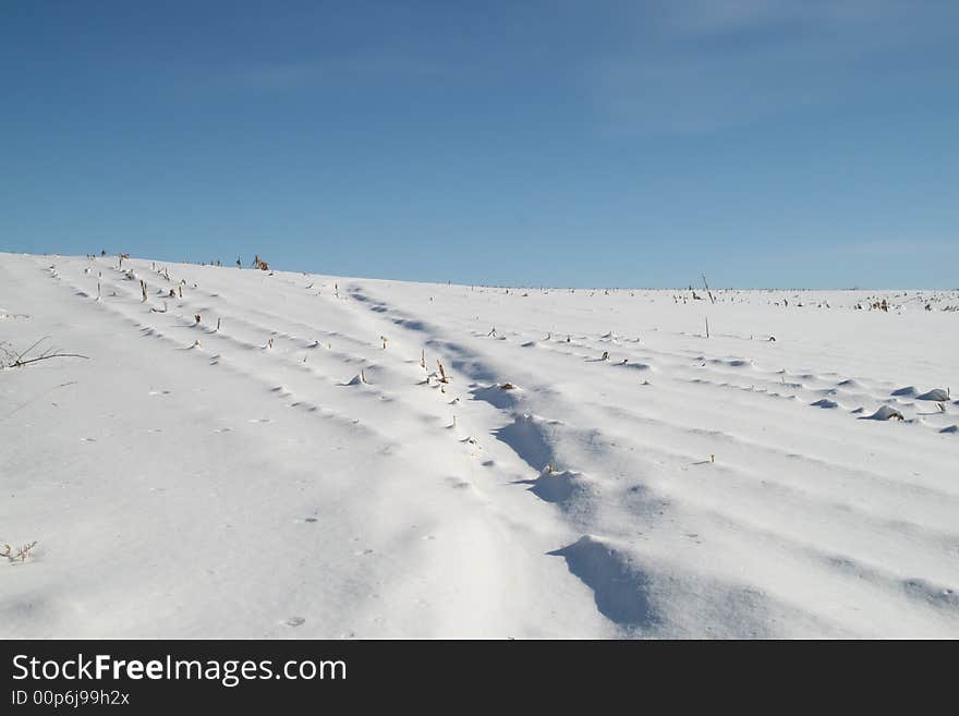 Snowy hill and sky