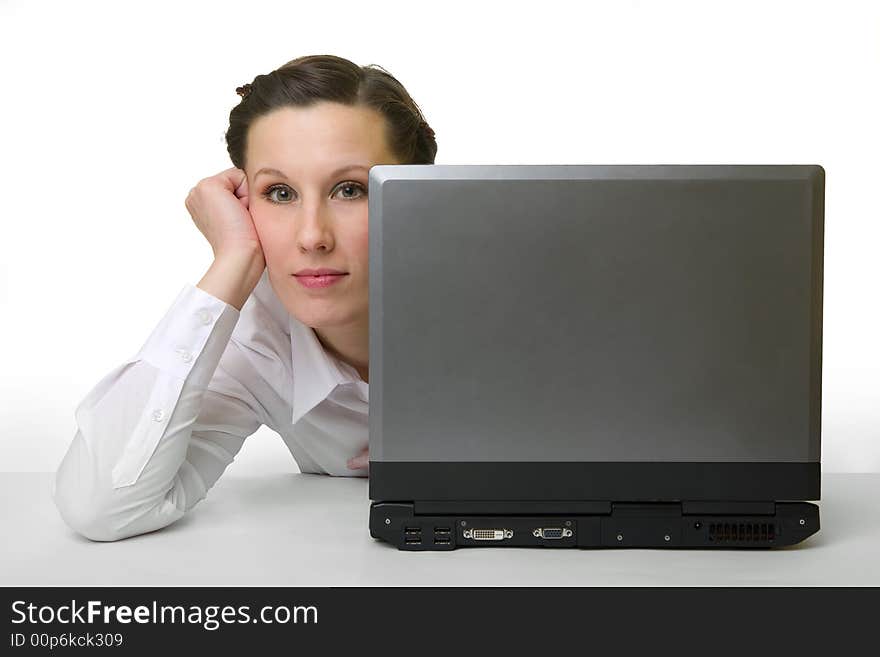 Portrait of caucasian woman hiding behind her laptop. Portrait of caucasian woman hiding behind her laptop