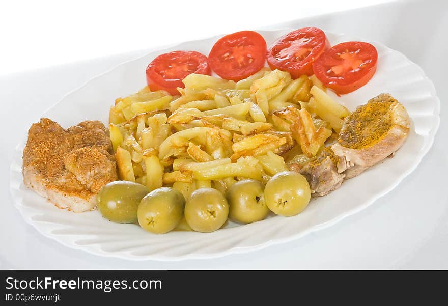 Pork chop with fried potatoes on plate. Pork chop with fried potatoes on plate