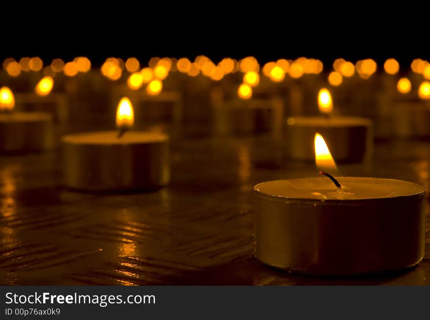 Close up view of the candles in the darkness