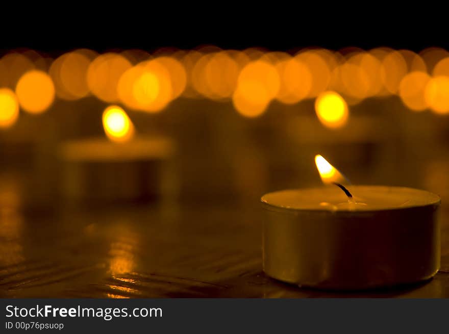 Close up view of the candles in the darkness