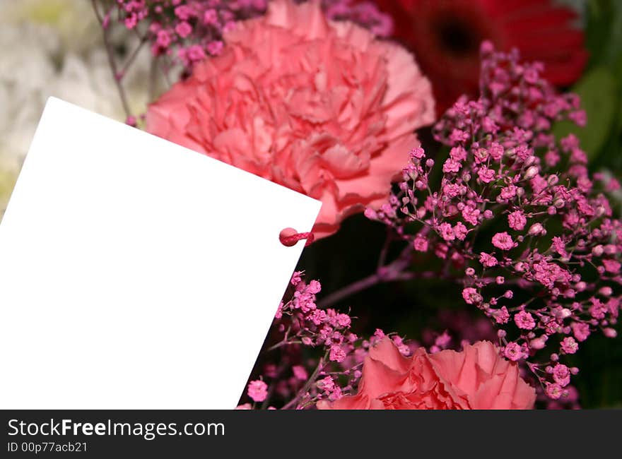 Blank card on a bouquet of flowers. Blank card on a bouquet of flowers