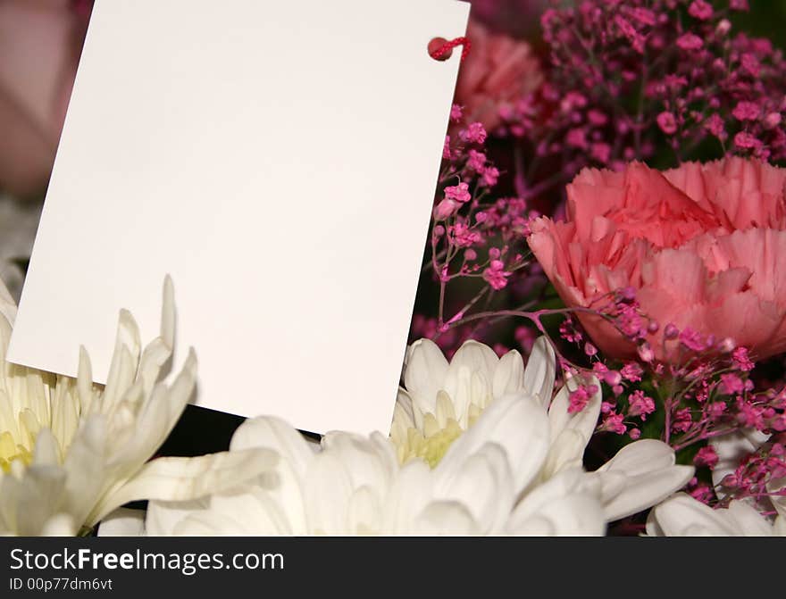 Blank card on a bouquet of flowers. Blank card on a bouquet of flowers