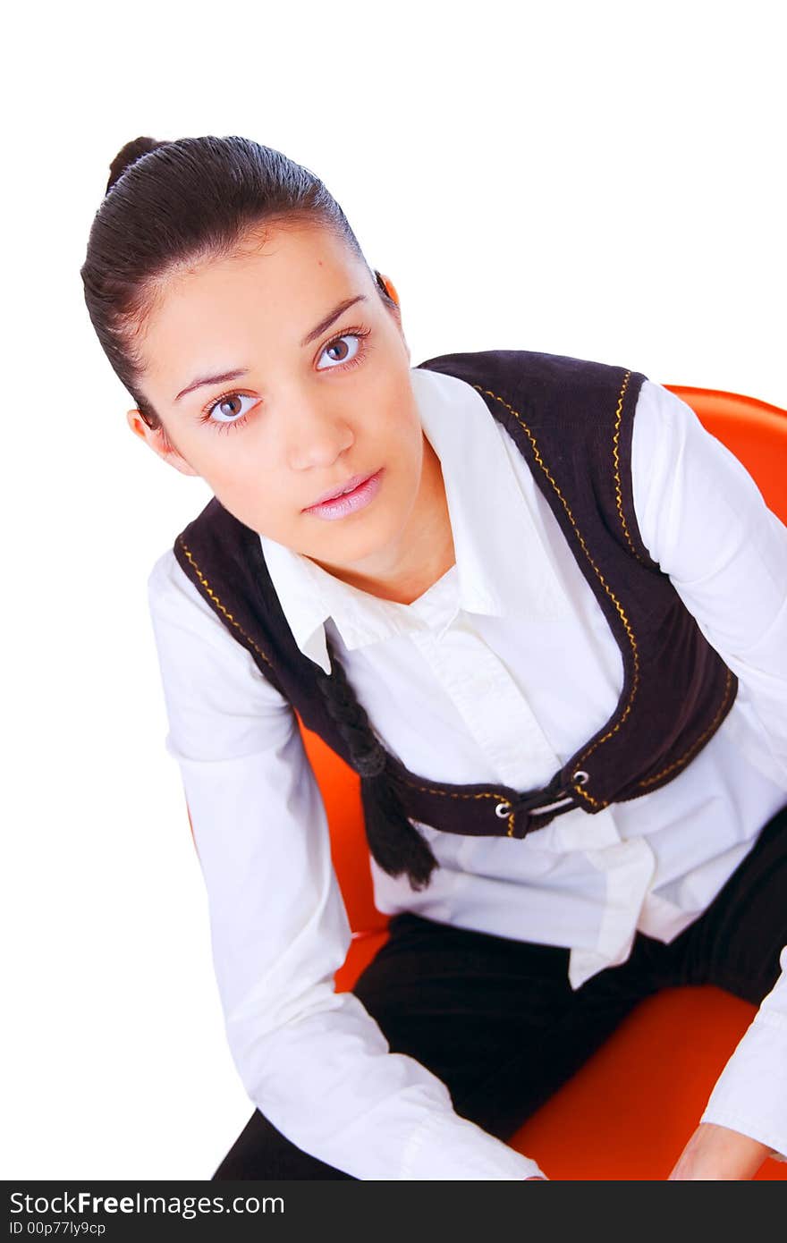 Portrait of a young business woman sitting on chair. Isolated on white background