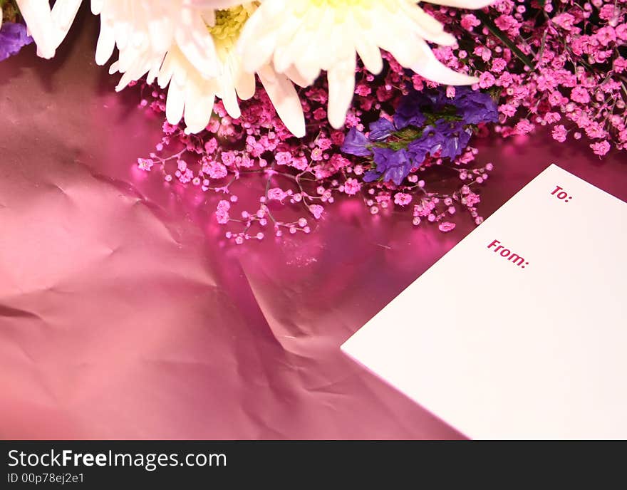 Blank card on a bouquet of flowers with a card. Blank card on a bouquet of flowers with a card