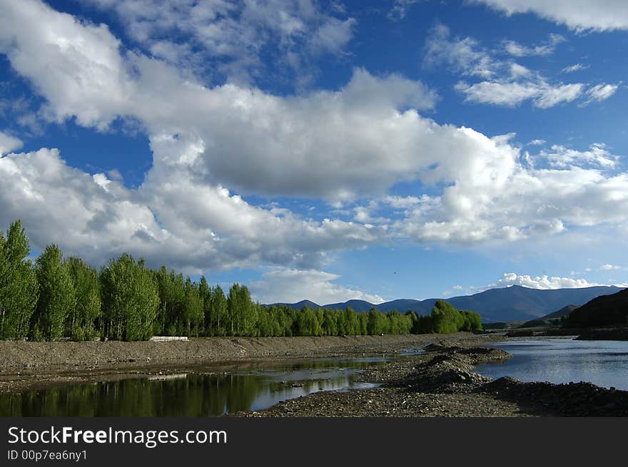 River, Trees And Sky