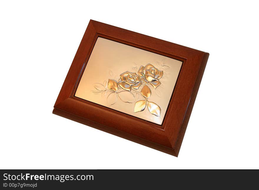 Jeweller ornament in a wooden casket. It is isolated on a white background