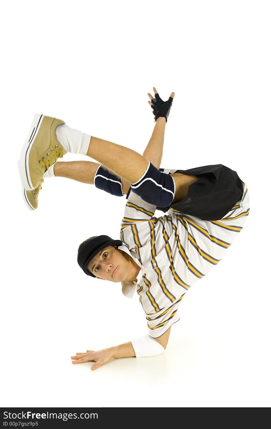 Young bboy standing on one hand. Holding legs in air. Looking at camera. Isolated on white in studio. Front view, whole body. Young bboy standing on one hand. Holding legs in air. Looking at camera. Isolated on white in studio. Front view, whole body