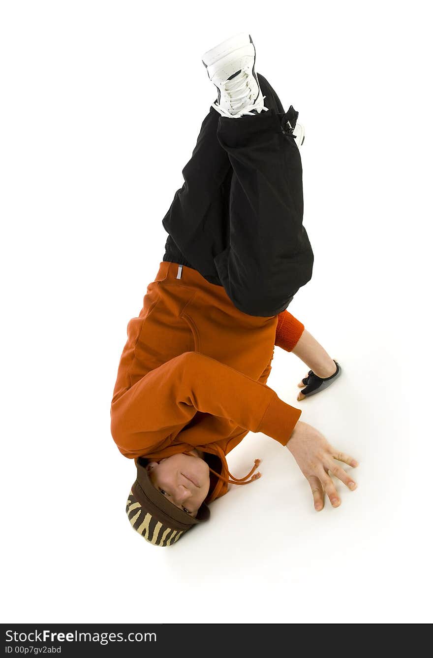 Young bboy holding up on hands and head. Holding legs in air. Looking at camera. Isolated on white in studio. Front view, whole body. Young bboy holding up on hands and head. Holding legs in air. Looking at camera. Isolated on white in studio. Front view, whole body