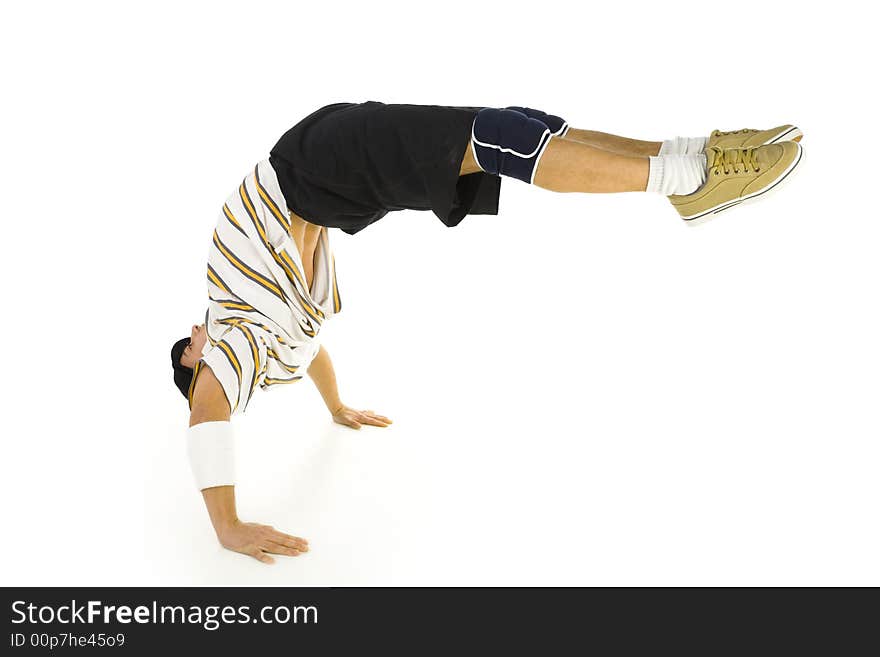 Young bboy standing on hands. Holding legs in air. Isolated on white in studio. Side view, whole body. Young bboy standing on hands. Holding legs in air. Isolated on white in studio. Side view, whole body