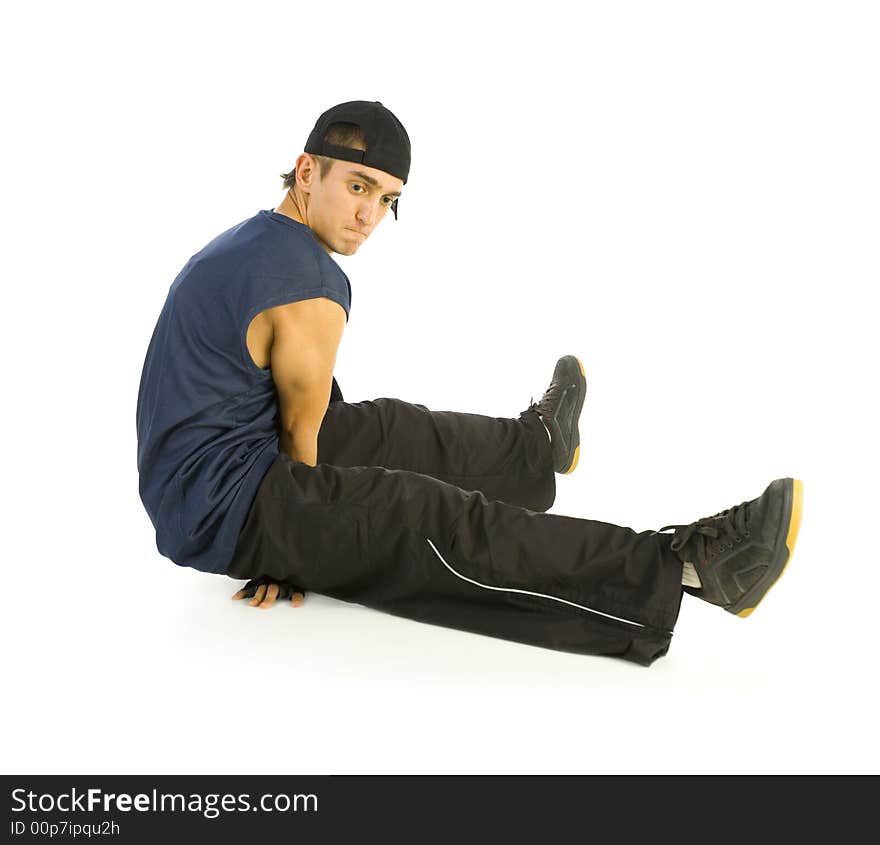 Young bboy holding up on hands and head. Holding legs in air. Isolated on white in studio. Side view, whole body. Young bboy holding up on hands and head. Holding legs in air. Isolated on white in studio. Side view, whole body