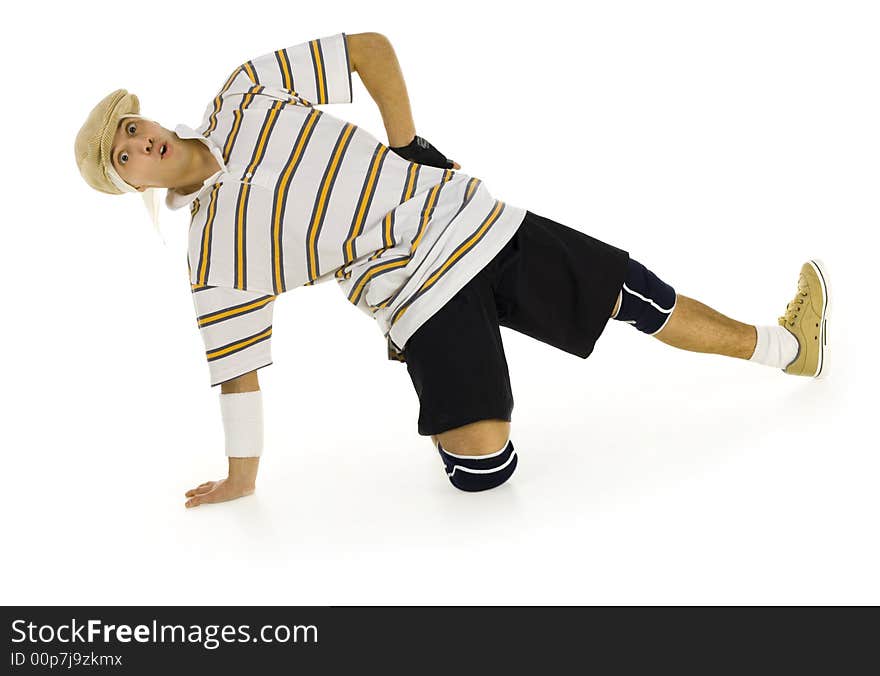 Young bboy holding up on hand and kneeling on one knee. Looking surprised at camera. Isolated on white in studio. Front view, whole body. Young bboy holding up on hand and kneeling on one knee. Looking surprised at camera. Isolated on white in studio. Front view, whole body