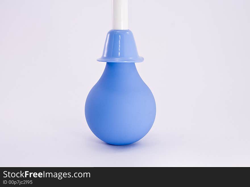 Rubber pear with a tip on white background