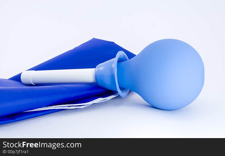 Rubber medical pear with a tip with a blue fabric on a white background. Rubber medical pear with a tip with a blue fabric on a white background